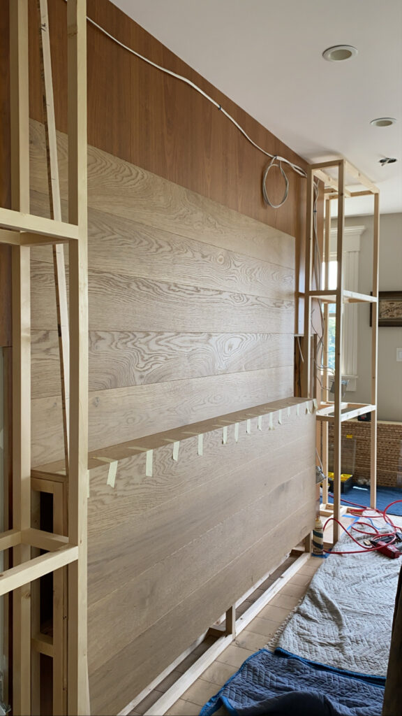 remodel using warm oak flooring to cover existing wall