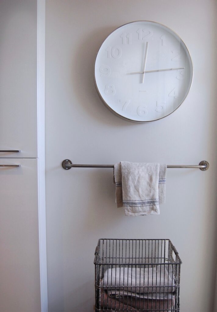 Oversized Karlsson clock in kids baathroom, keeps them on time